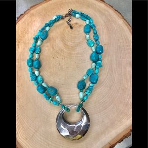 Turquoise stone necklace with silver pendant